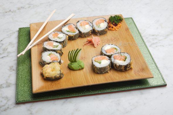 dish with sushi roles on marble table - Stock Photo - Images