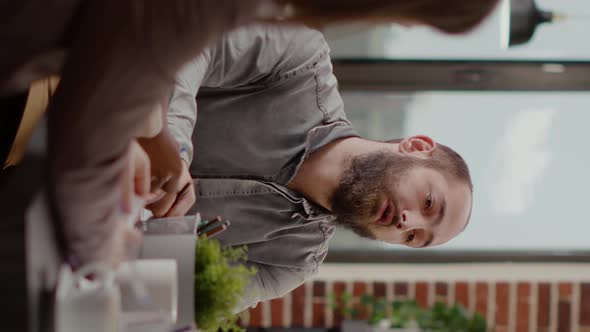 Vertical Video Close Up of Employee Meeting with Coworkers for Project Planning alt