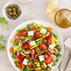 Greek salad with feta cheese, tomatoes, cucumbers, pepper, red onion and green olives. Top view - PhotoDune Item for Sale