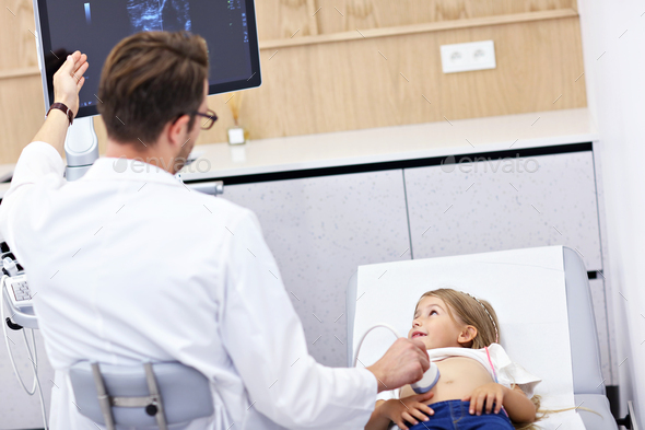 Doctor testing young girl with usg - Stock Photo - Images
