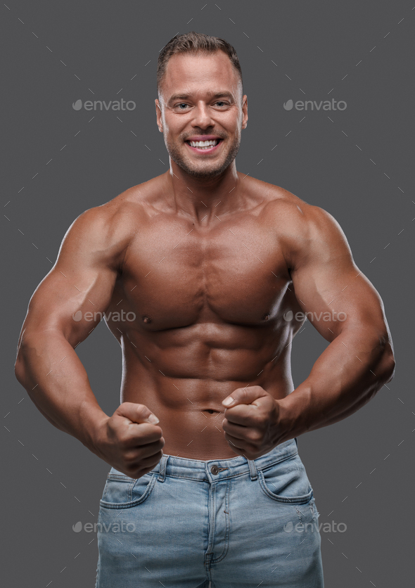 Happy Bodybuilder With Naked Torso Posing Against Gray Background Stock Photo By Fxquadro