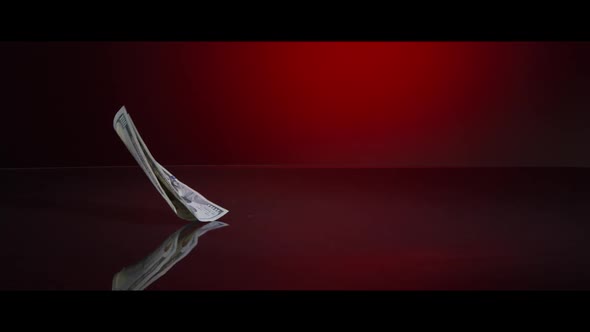 American $100 Bills Falling onto a Reflective Surface - MONEY 0025 alt