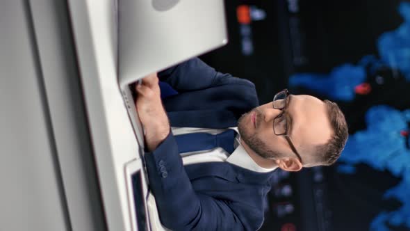 VERTICAL VIDEO POV Successful Business Male in Suit Working Use Laptop Pc at Innovation Workspace alt