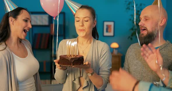 Smiling Girl is Standing Among Balloons with Party Cap on Head Celebrating Her Birthday with alt