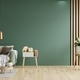 Green sofa with table on green wall and wooden flooring. - PhotoDune Item for Sale