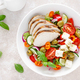 Grilled chicken breast and fresh greek salad with feta cheese. Top view - PhotoDune Item for Sale