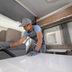 RV Rental Worker Vacuuming a Camper Van - PhotoDune Item for Sale