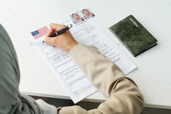 Filling In Application Form At Table - Stock Photo - Images