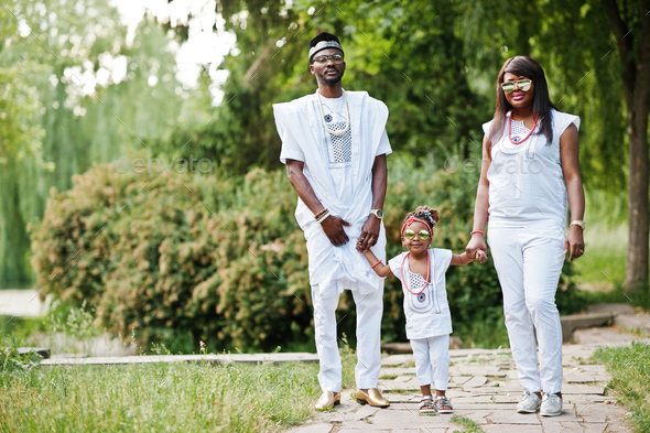 African american rich family at white nigerian national clothing