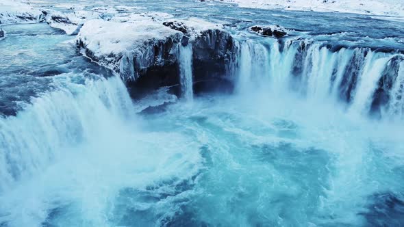Spectacular Aerial Drone Shot of Mighty Godafoss Waterfall in North Iceland During Icy Winter Day