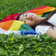 Woman lying down with LGBT flag - PhotoDune Item for Sale