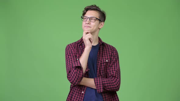 Young Handsome Teenage Nerd Boy Thinking alt