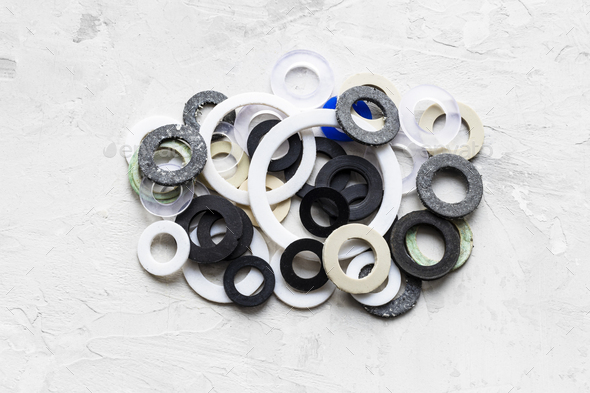 pile of various gaskets for plumbing water systems - Stock Photo - Images