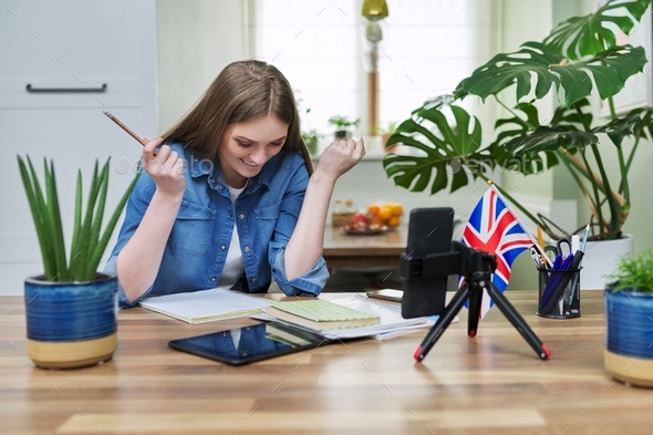 Online English lesson, young woman teaching English to students