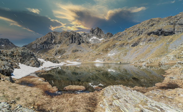 Mountain landscape with lake processed in post production sky not real - Stock Photo - Images