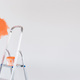 Ladder with paint in bucket near color wall indoors. Copy space - PhotoDune Item for Sale