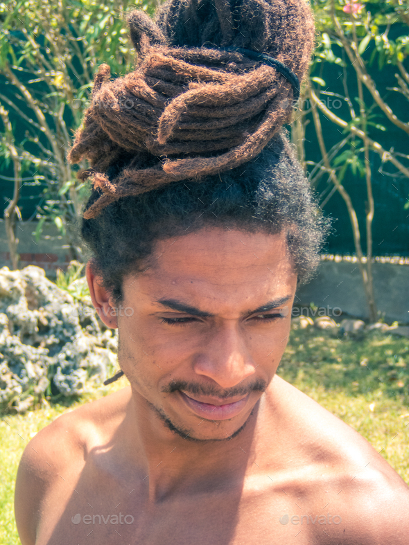 Black Man With Afro Hair And Dreadlocks Gathered Over His Head Stock  black-man-with-afro-hair-and-dreadlocks-gathered-over-his-head-stock