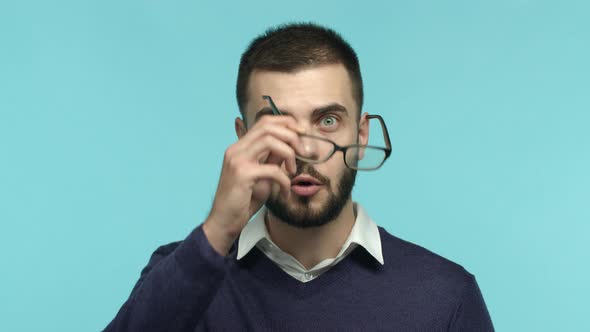 Close Up of Handsome Guy Taking Off Glasses and Stare Surprised at Camera See Something Amazing
