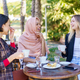 Joyful multiracial women chatting on terrace of cafe - PhotoDune Item for Sale