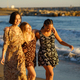 Diverse girlfriends walking near waving sea - PhotoDune Item for Sale
