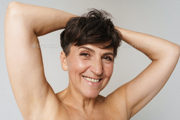 Mature Half Naked Woman Smiling While Showing Her Armpits Stock Photo By Vadymvdrobot