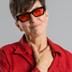 Mature european woman wearing sunglasses smiling at camera - PhotoDune Item for Sale