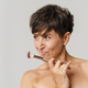 Mature half-naked woman smiling while posing with powder brush - PhotoDune Item for Sale