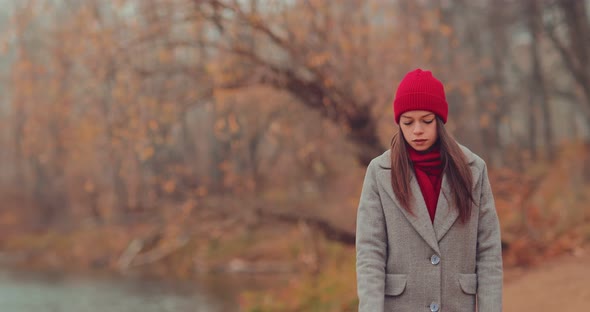 Beautiful Woman Walks Near the Shore Holds a Leash in Her Hands She is Happy alt