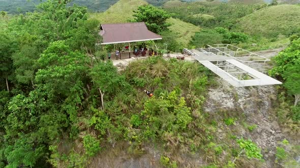 Aerial view of person doing rafting above Inabanga river in Danao, Philippines. alt