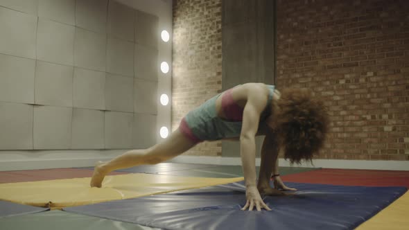 Young woman stretching in fitness Centre