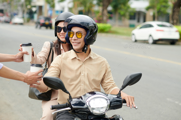 Business Couple on Scooter Ordering Coffee