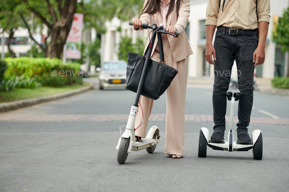 IT Company Workers on Electric Scooters