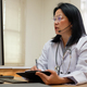 asian woman doctor visit patient video call online diagnose symptom at clinic - PhotoDune Item for Sale