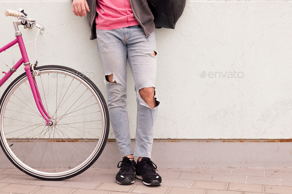 unrecognizable urban young man with vintage bike