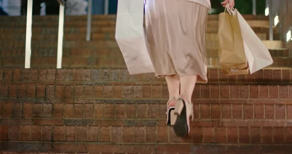  Slow Motion Shopping Bags. Woman Wearing Fashionable Heels Walking Up Stairs alt