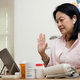 asian woman telemedicine doctor online visit with computer at home - PhotoDune Item for Sale