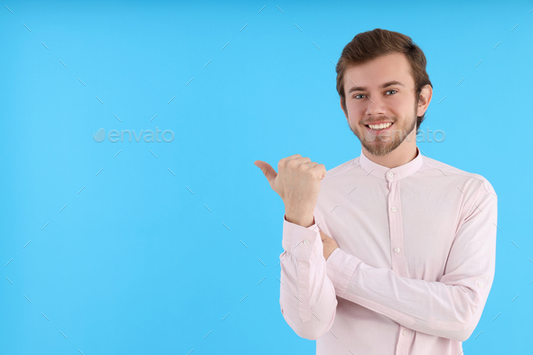 Concept of people, young man on blue background - Stock Photo - Images