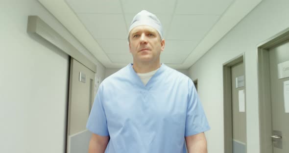 Surgeon walking in hallway alt