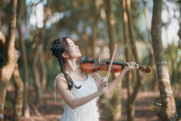 girl is playing the violin - Stock Photo - Images