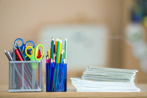 Premium Photo  School supplies on a desk stack of books notebook and many  pencils laying on the table