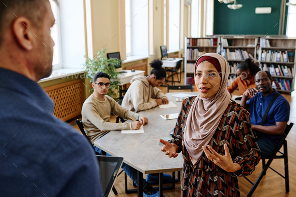 Muslim Woman Talking To Teacher