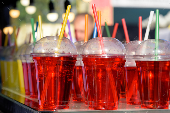 Different colors of cold water in a plastic cup. Stock Photo by ...