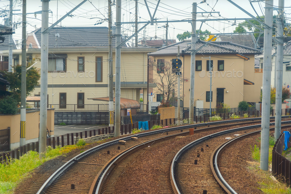Japanese railway with a local train run through city. Tourist attraction
