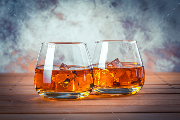 Two glasses of whiskey with ice. Still life. Brandy, bourbon