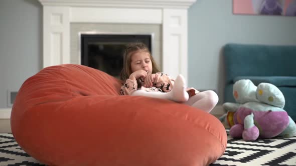 Portrait of Caucasian Lovely Girl with Lollipop in Mouth Enjoying Happy Carefree Childhood and alt