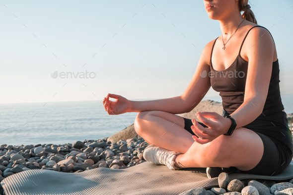sport fit outdoor sea.girl goes sports,fitness,yoga seashore.Meditation, relaxation, mental health