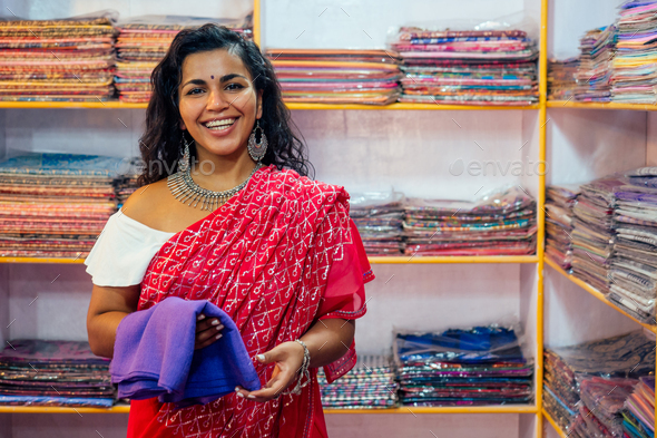 business lady in red traditional sari and jewelery clothes shop owner cashmere