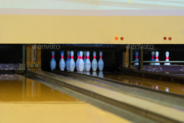 Lead machine bowling pinsetter and lane sport community center activity recreation game lifestyle.