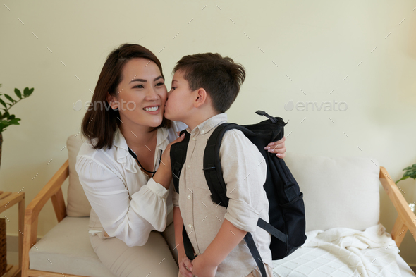 Boy Kissing Mother on Cheek