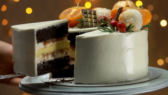 Hand Takes a Piece Chocolate Cake with Cheese Souffle alt